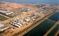 Aerial view of the treatment plant showing small water reservoirs under treatment.