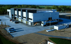 Aerial view of the building housing the water treatment tanks. A cistern can be seen next to the building